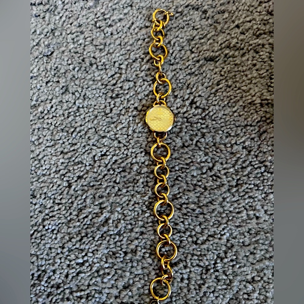 Coach gold chain link watch.